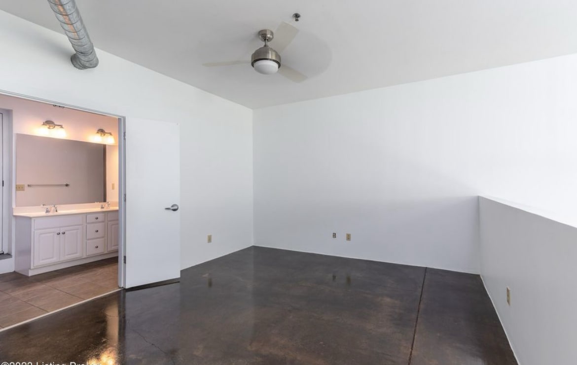 bedroom, leading into second floor full bath - 400 E Main St