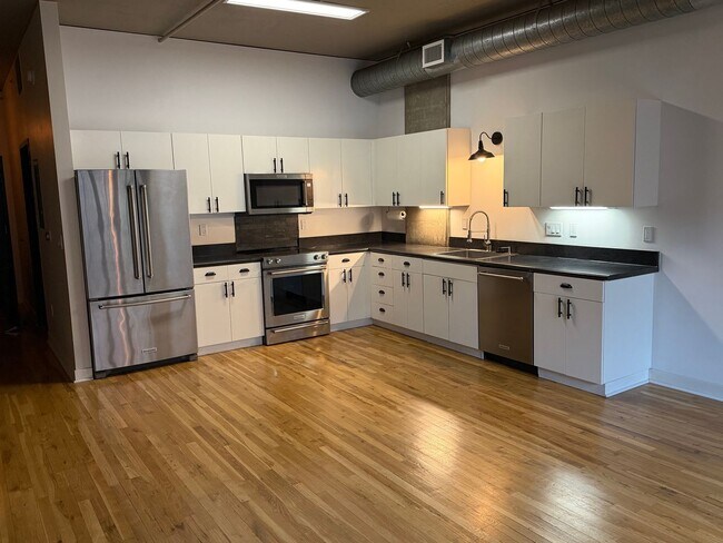 Building Photo - McKenzie Lofts - 2nd floor west facing Pearl District studio w/parking/storage/covered balcony