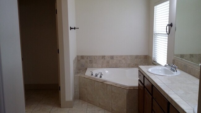 Building Photo - Three bedrooms plus an office.. Gorgeous home in Pepper Hills with tandem 3 car garage. Newer car...