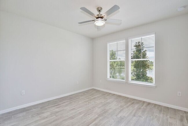 Building Photo - Modern 5/3 Water-View Home in Weslyn Park ...
