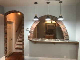 Pendant lighting over the marble tiled bar. - 116 Bowmar St