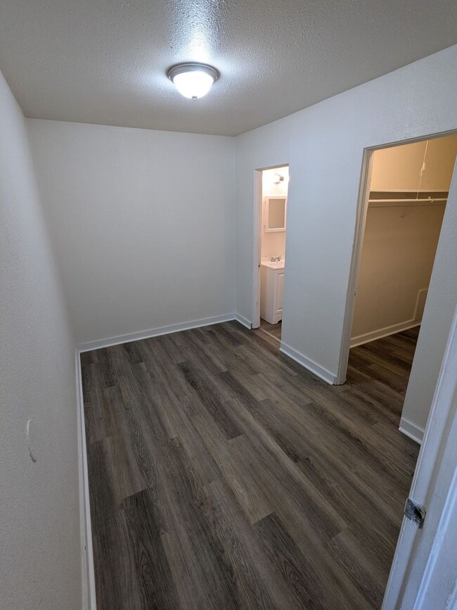 Building Photo - Ground Level 2 Bedroom, 2 Bath apartment. New flooring and paint. Tenant pays electric and natura...