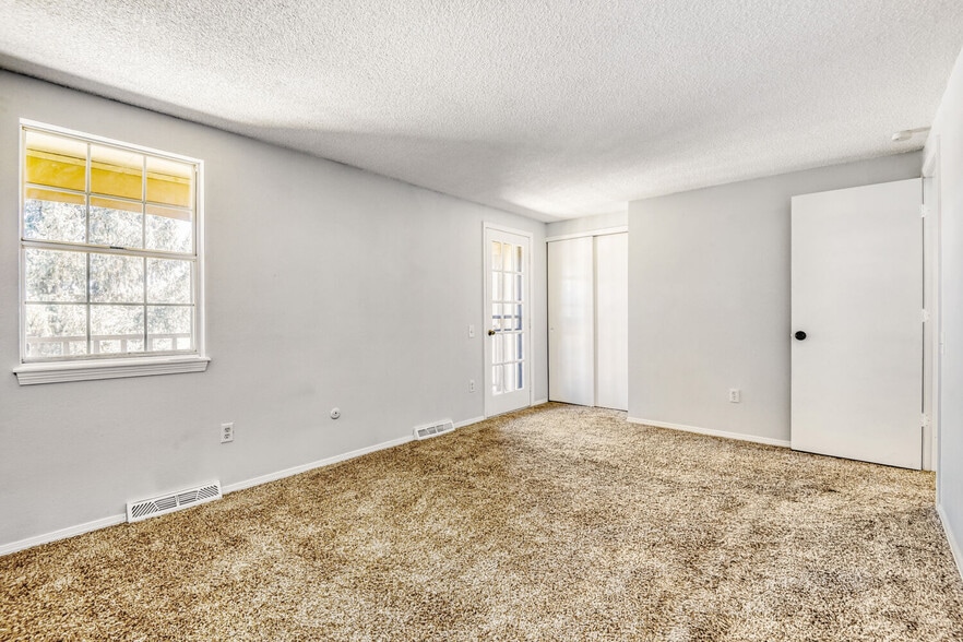 Primary Bedroom/door to balcony - 8780 E Yale Ave