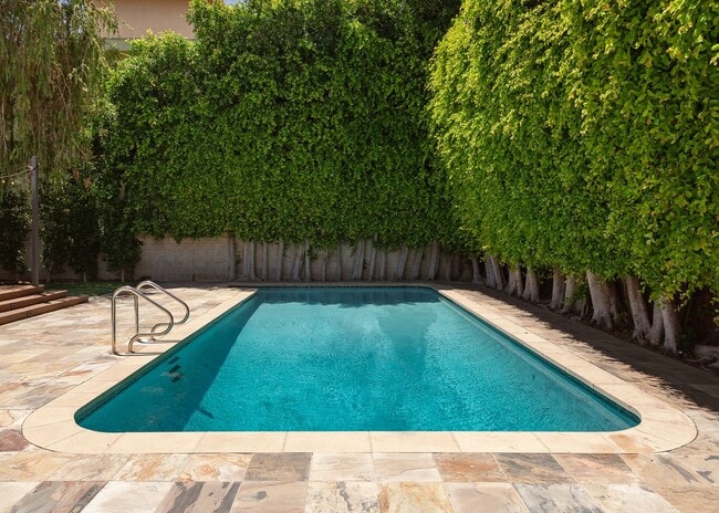 Building Photo - *Unfurnished* Gorgeous 4-Bed Oasis with Po...