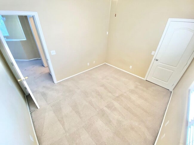 Building Photo - THIS SPACIOUS RESIDENCE FEATURES 4 BEDROOM...