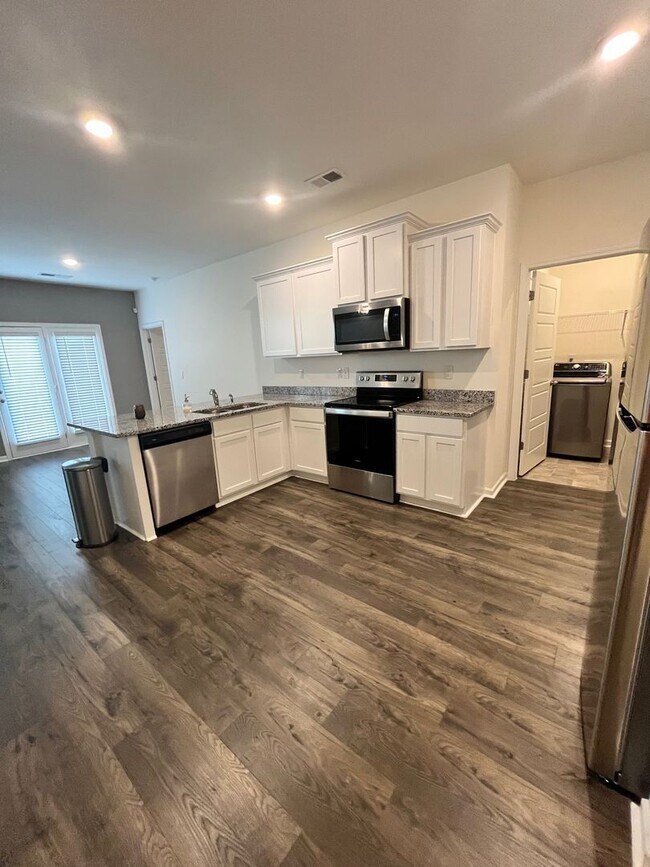 Building Photo - HALF-PRICE RENT for Your First Month: Move...