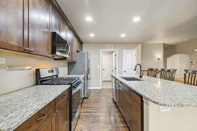 Building Photo - Stylish Cordera Ranch with Finished Basement, Gourmet Kitchen, and Ideal D20 Location