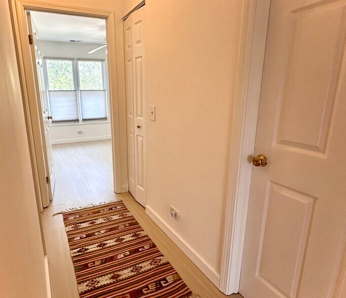 Hallway - entrance to second bedroom. Makes a great office with morning sun. - 174 Hemingway Ct