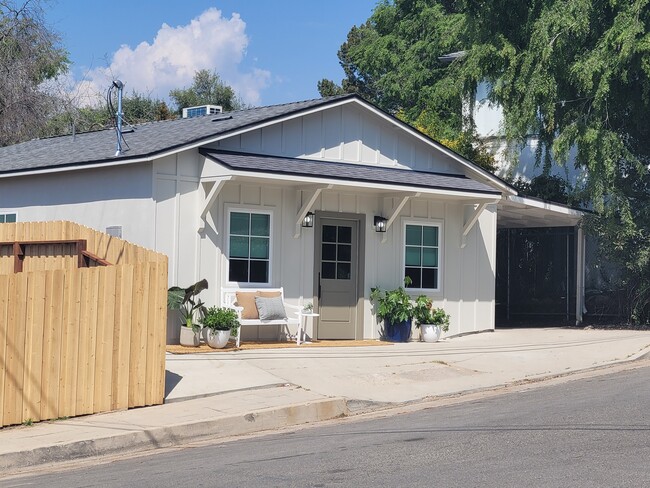 Front of the house. Note car port was demo'd per the city but the open parking pad is included. - 3649 Cazador Dr