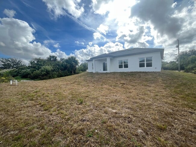 Building Photo - NEW CONSTRUCTION-Spacious 4 Bed / 2 Bath / 2 Car Garage Home in Lehigh Acres