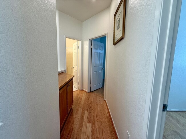 Building Photo - Spacious 3 Bedroom 2.5 Bath Townhouse with Private Garden Patio & a Community Pool/Spa! Attached ...