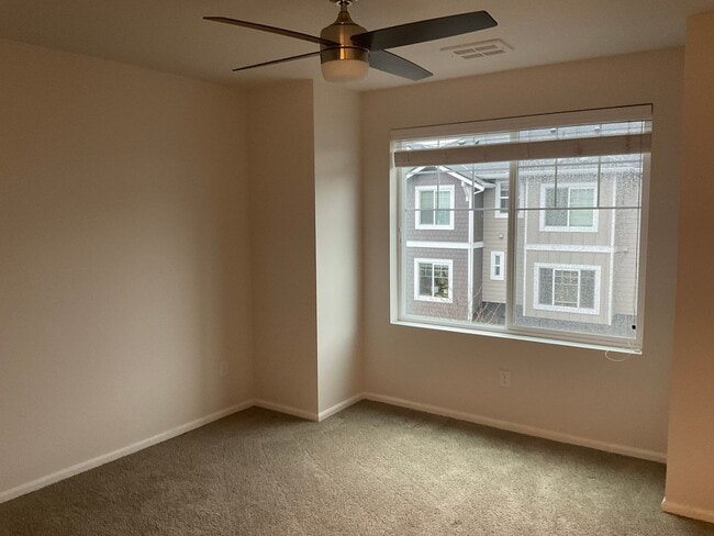 Building Photo - Riverfront Townhome with Tandem Garage & Fenced Yard