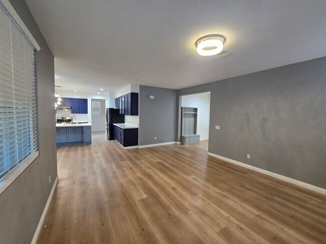 Building Photo - Open-Concept Living with Downstairs Bedroom & Enclosed Patio Retreat