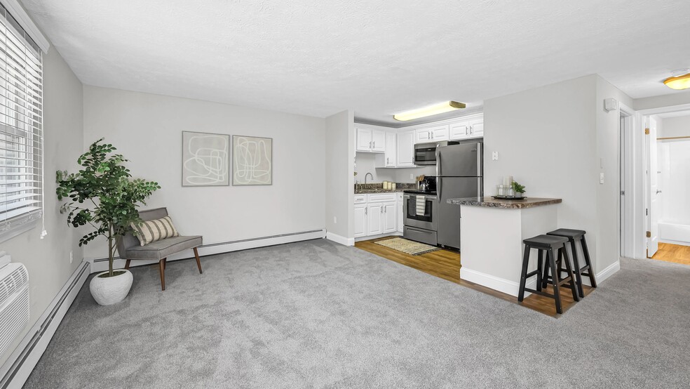 Designed with comfort and convenience in mind, this open-concept living space provides plenty of room to relax, entertain, and personalize your home. - Edgewood Court
