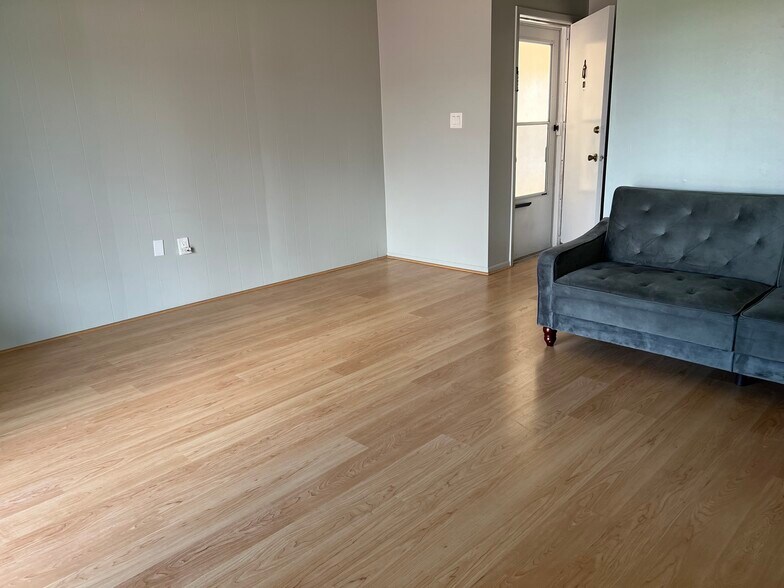 Another view of living room looking toward entrance hall with front door - 3535 41st Ter S