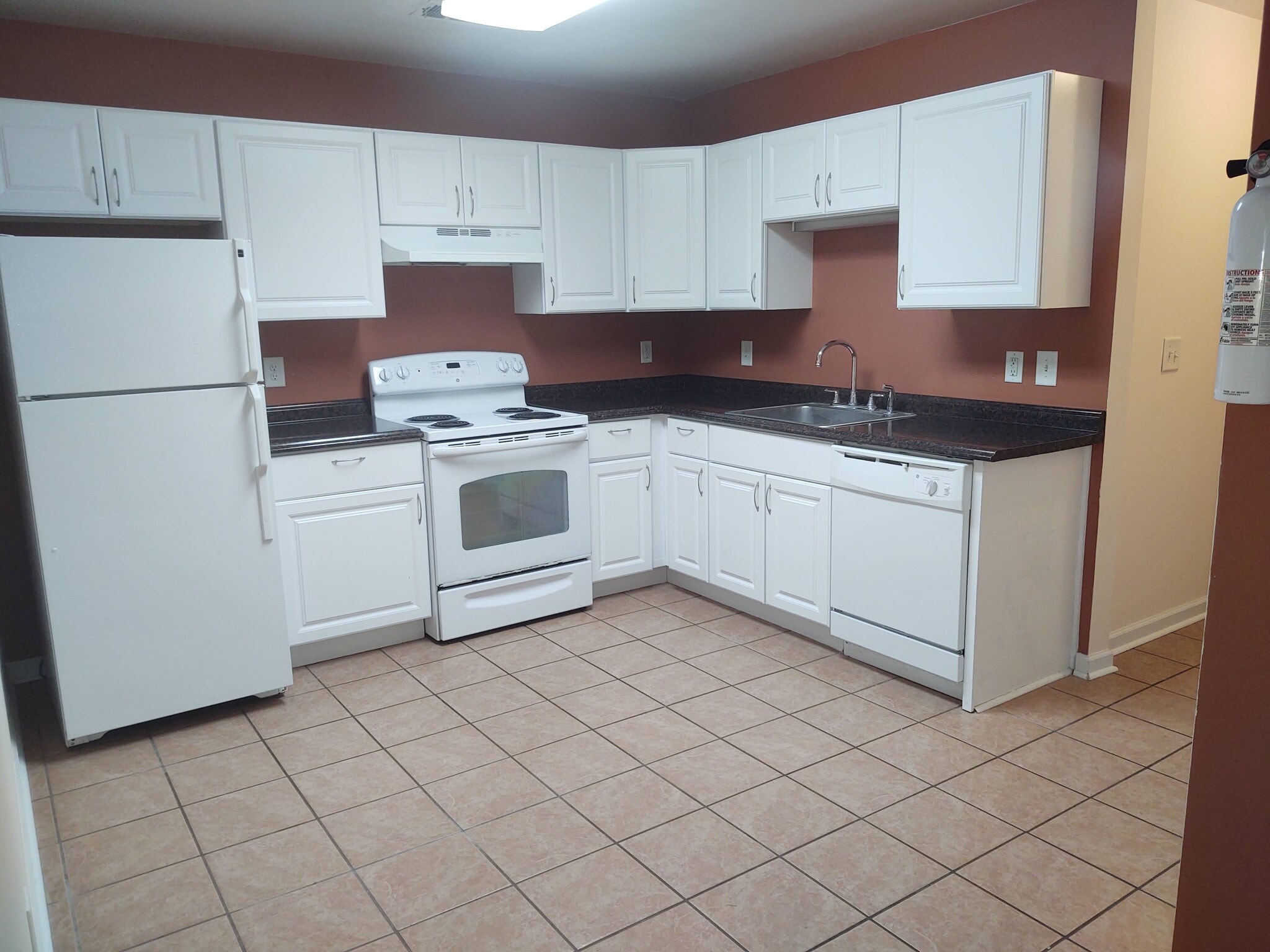 Kitchen with full size fridge, stove & dishwasher - 247 Hereford Cir
