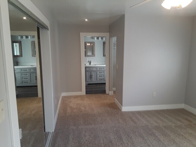 Master bed looking into bath & walk in closet - 608 Elefa St