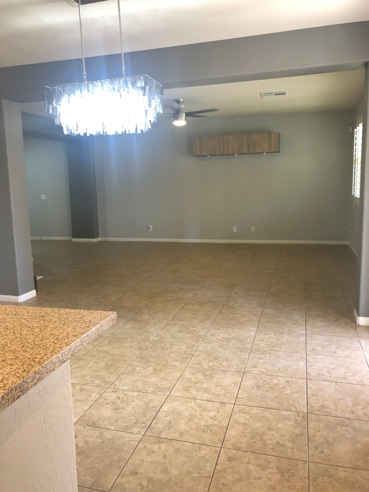 a chandelier for your dining and a storage upper drawer to enhance the living area when TV is installed below it - 263 Garden Trellis Ct