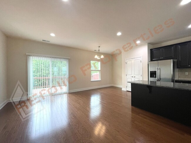 Building Photo - Beautiful 3 Story 3 Bedroom Townhouse with Huge 1st Floor Flex Space with Access to Patio + 2 Car...