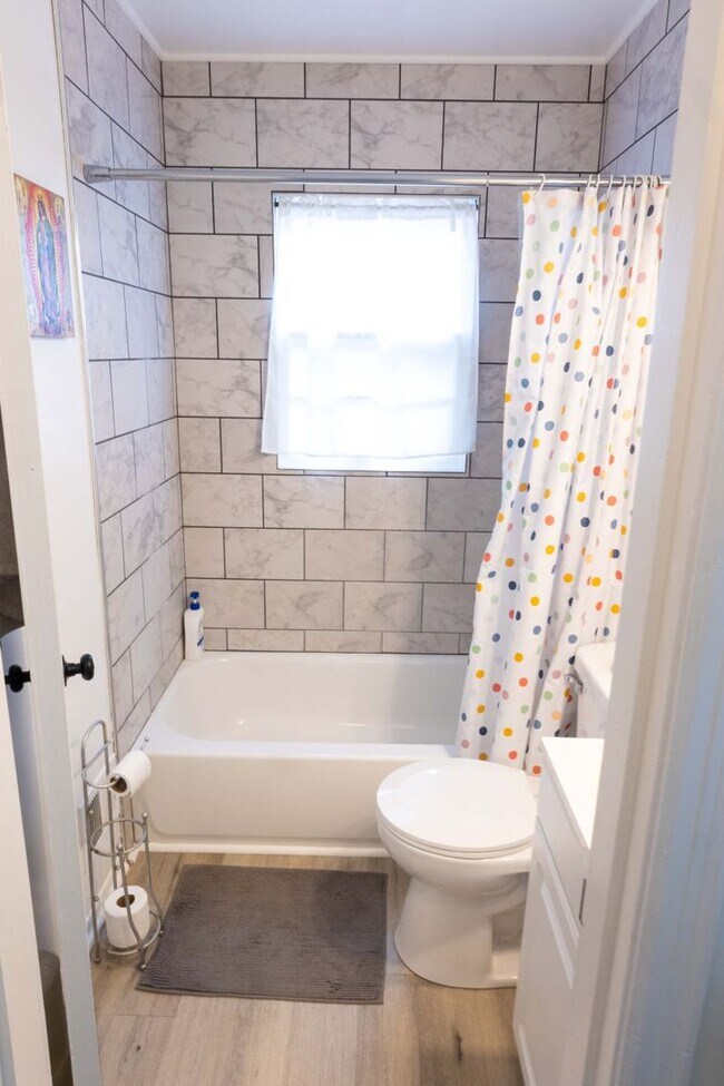 Building Photo - Charming home with a finished basement and...