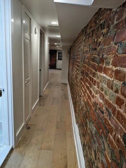 Hallway between living space and rear rooms - 1317 Irving St NW
