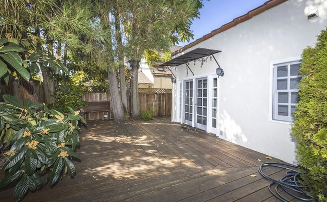 Building Photo - Charming Spanish Style Cottage with Incredible Deck- Gardener's Delight!