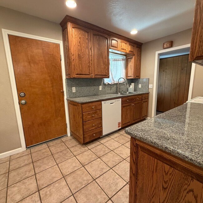 Building Photo - Adorable house with large deck,  yard and RV access