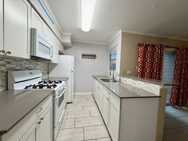 Building Photo - Modern Medical Center Gem with Stylish Upgrades & Private Patio Living