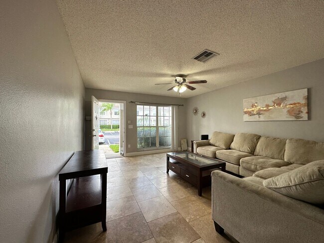 Building Photo - Beautiful Townhome in a gated community with assigned parking spots and a community pool