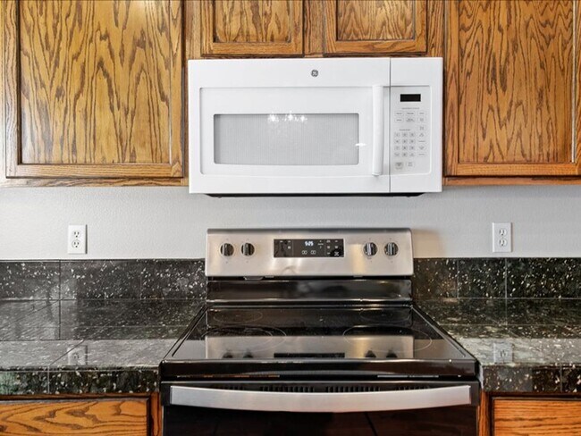 Building Photo - June Rent Free!!  Move Today!  Four Bedroom, Three Bath Home with Beautiful Backyard, Two Car Gar...