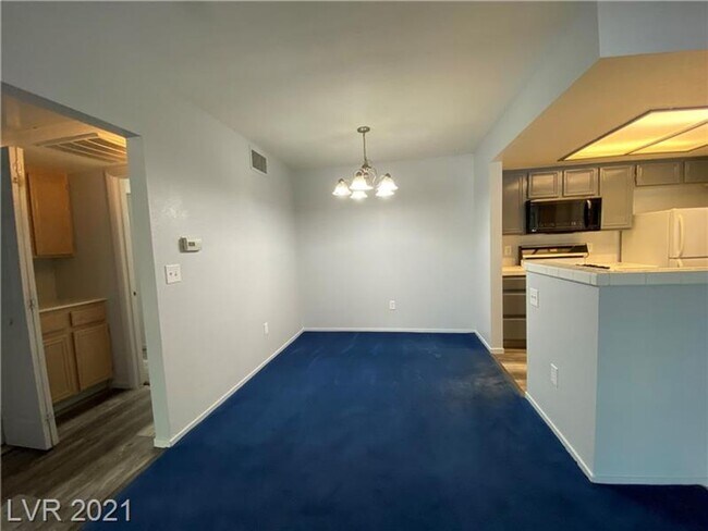 Building Photo - Charming 1-Bedroom Condo in Gated 89128 Co...