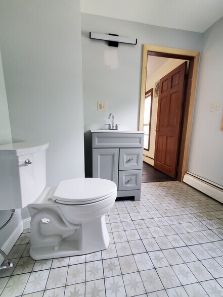 484 Main St, Apt 201, Bath is getting some final work done and a mirror - 484 Main St