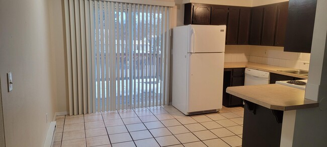 Kitchen Dining Area, Slider to Deck and Back Yard - 130 E Dakota Ave