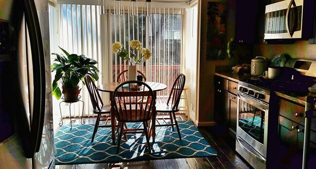 Kitchen with solarium (note: all furnishings have been removed) - 13 Steeple Ct