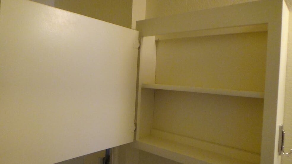 Bathroom storage - 721 Summerwood Ln
