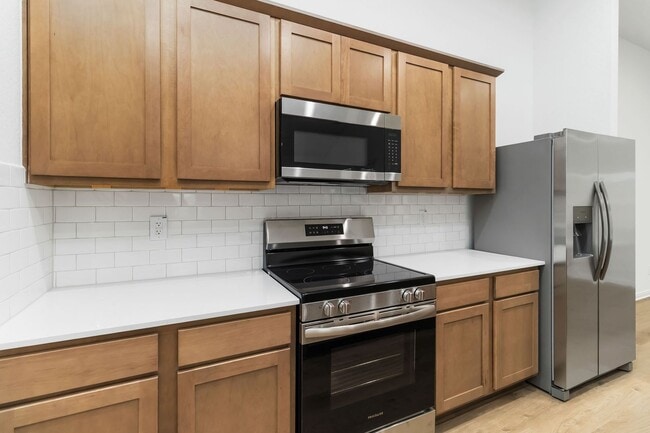 Building Photo - Brand-New 2-Story Townhome with Large Private Yard & 2-Car Garage