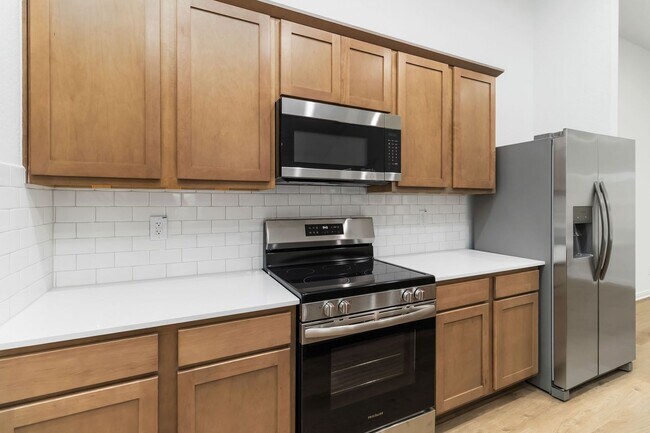 Building Photo - Brand New 4BR Home | Primary Suite Downstairs & Private Yard