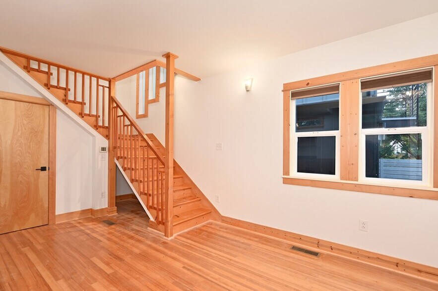 Living room/stairs to 2nd floor. - 8752 Dayton Ave N