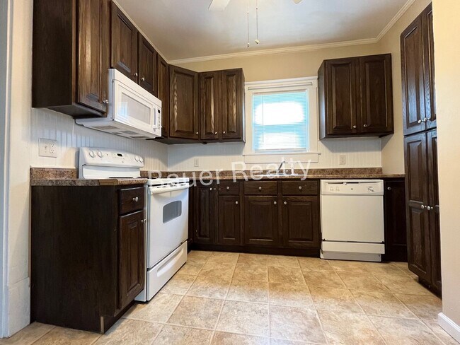 Building Photo - Three bedrooms, one and a half baths