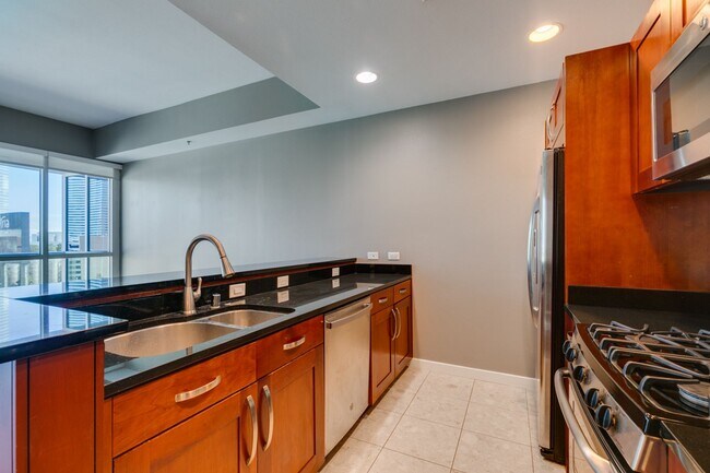 Building Photo - Iconic Strip-View Luxury | Elegant 1BR + Den High-Rise Residence