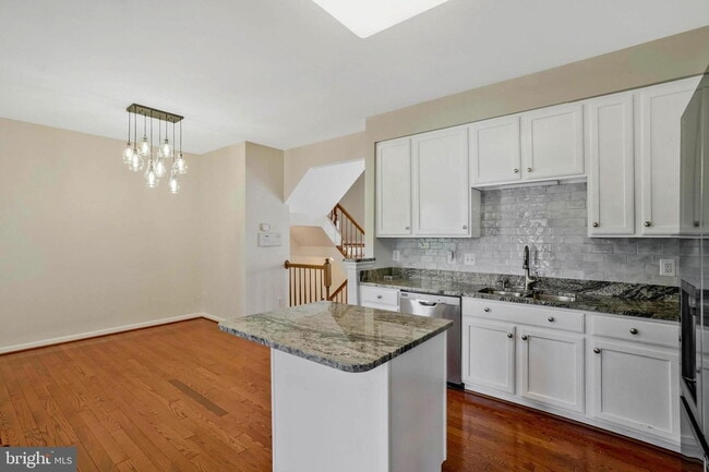 Building Photo - This beautifully maintained brick-front, three-level townhome is located in a highly sought-after...