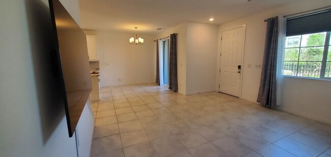 Building Photo - Beautiful townhome features a bright, open-concept layout