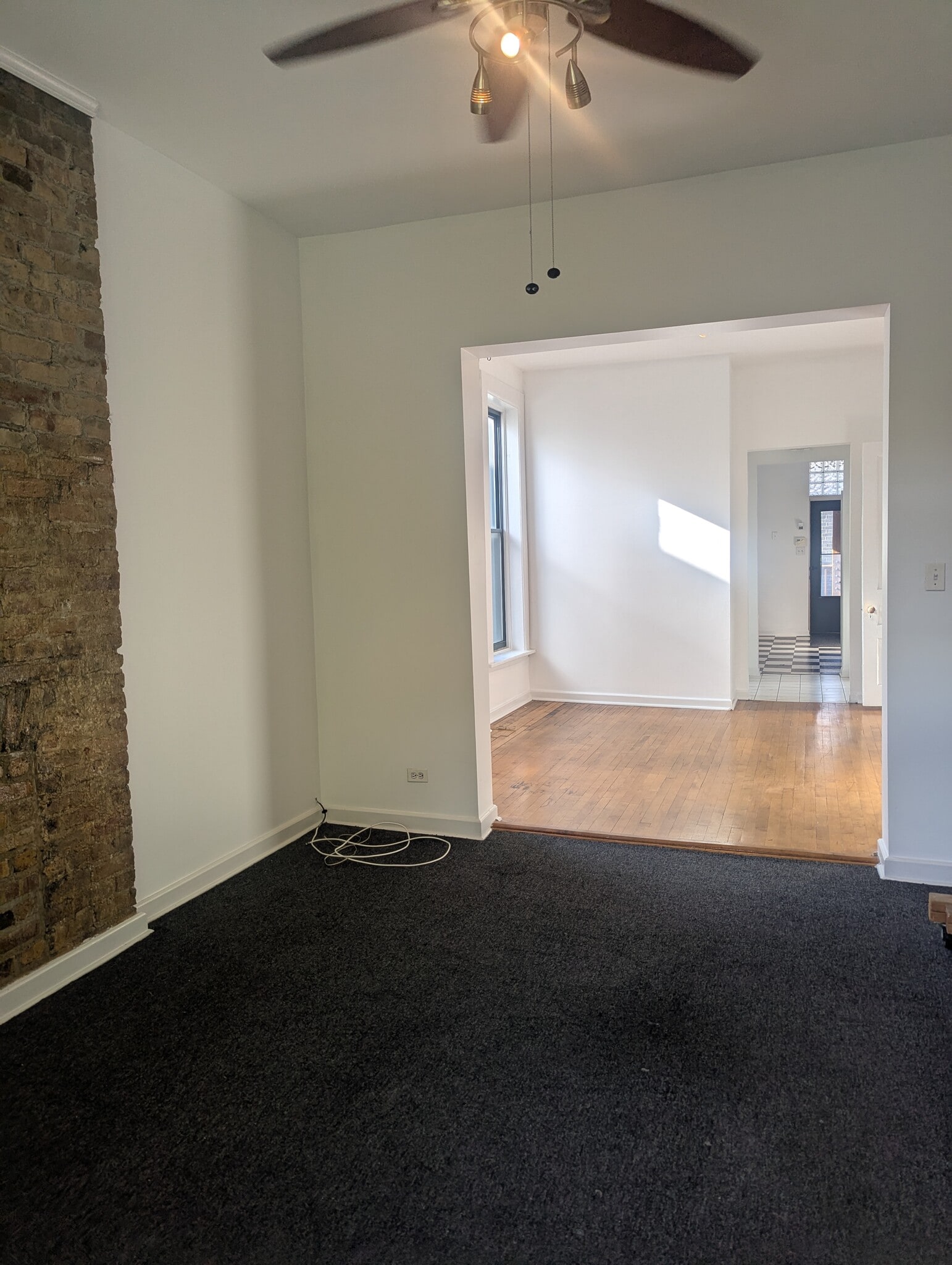 Looking north from Living Room #2 to the back Kitchen and rear deck - 1230 W Hubbard St