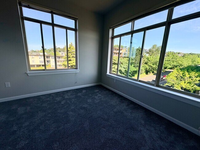 Building Photo - Top-Floor 2BR with Lake Union Views + Garage Parking + Internet Included!