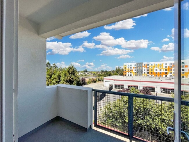 Building Photo - Modern 2BD Fremont Condo – EV Charger, Balcony, & Walk to BART