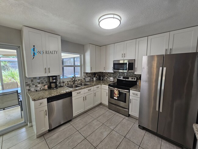 Building Photo - JUST REDUCED... must see beautiful 3/2 1071 Sq. Ft. with a POOL!! Gorgeous updated Kitchen & bath...