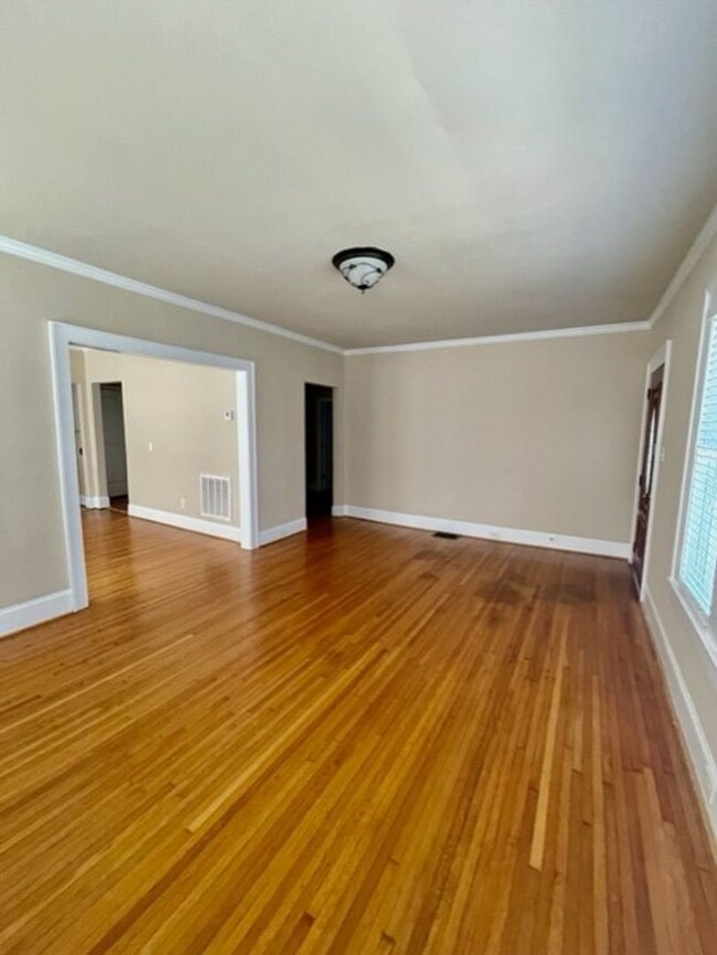 Building Photo - Introducing WesleyHeights401, a charming 3...