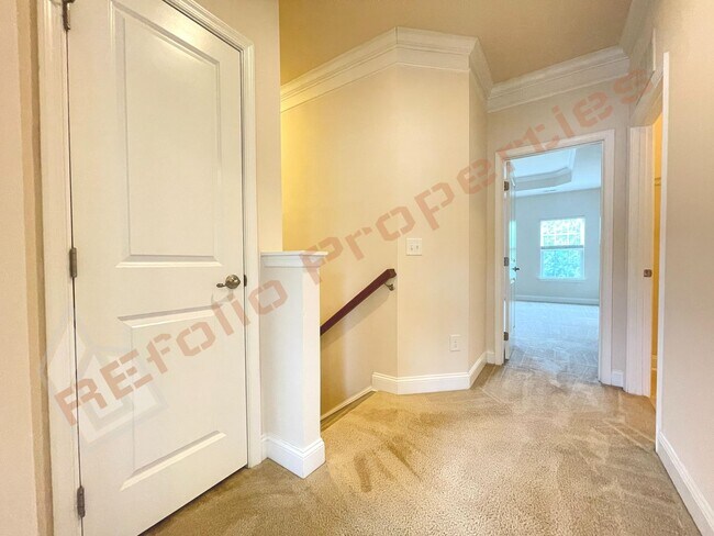 Building Photo - Beautiful 3 Story 3 Bedroom Townhouse with Huge 1st Floor Flex Space with Access to Patio + 2 Car...