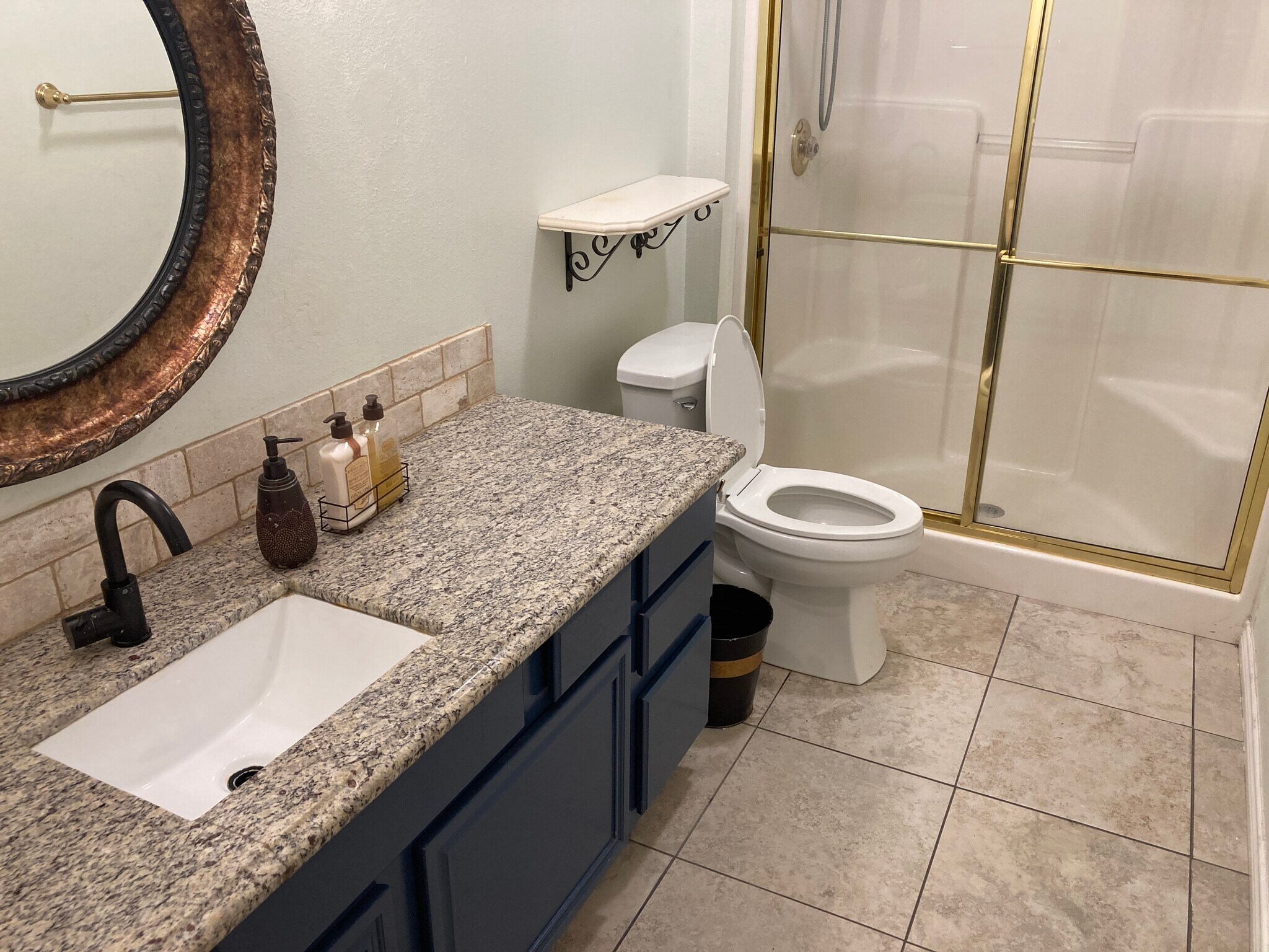 Full hallway bathroom with granite countertop. - 16485 County Road 164