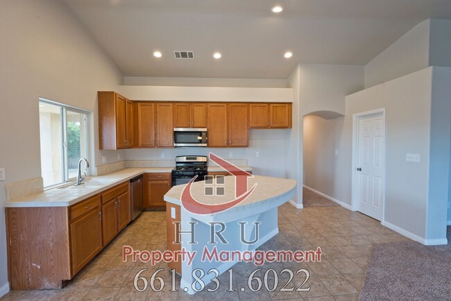 Building Photo - SW-Bakersfield  features 4 bed 2 bath with...